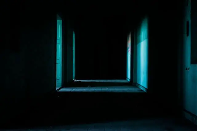 open doors in a dark hallway