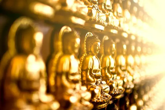 yellow buddha figurines